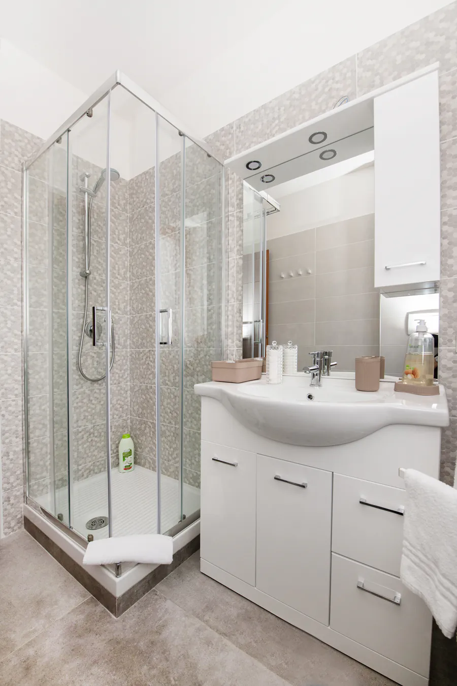 Bathroom with shower and vanity unit
