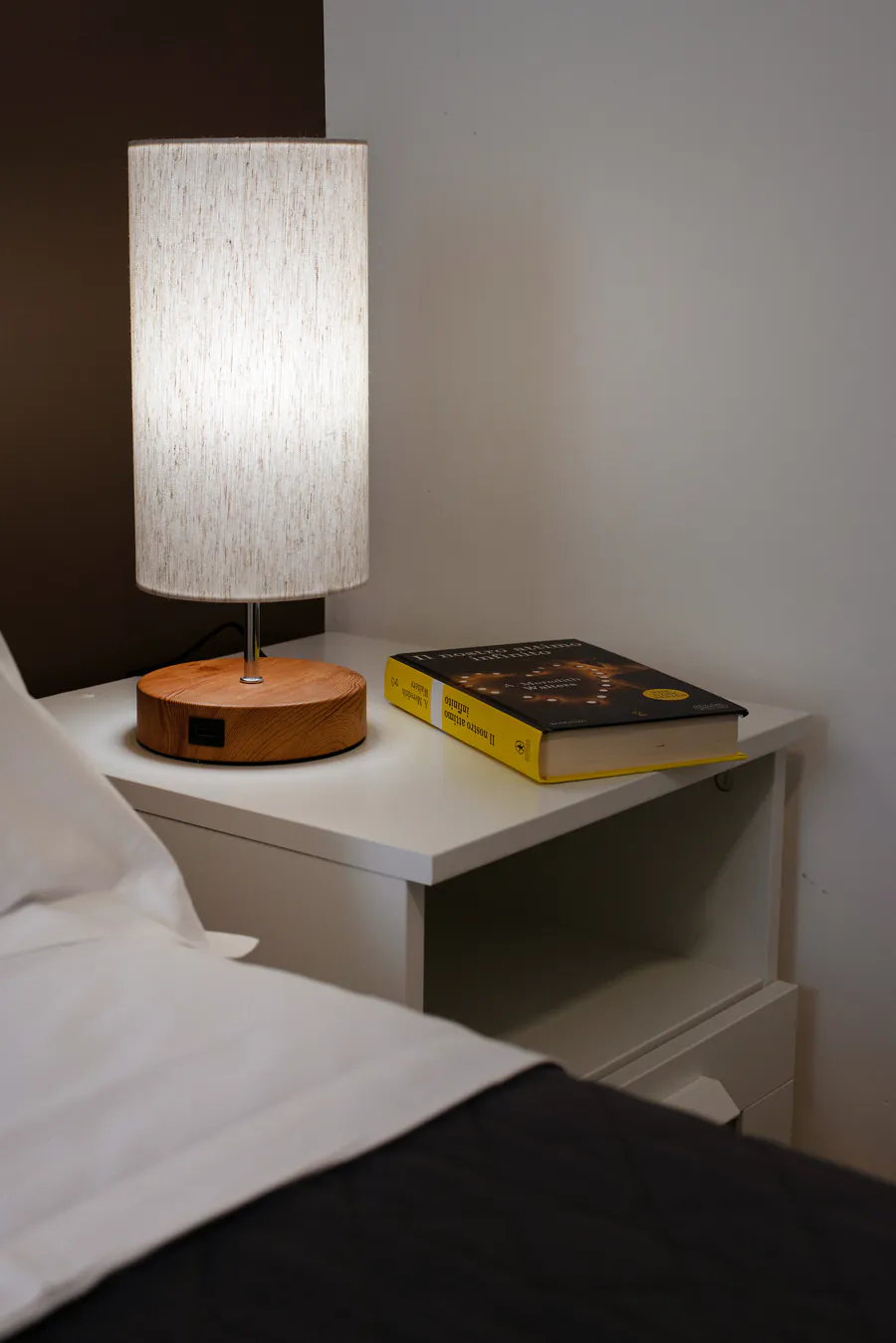 Lamp and book on the bedside table