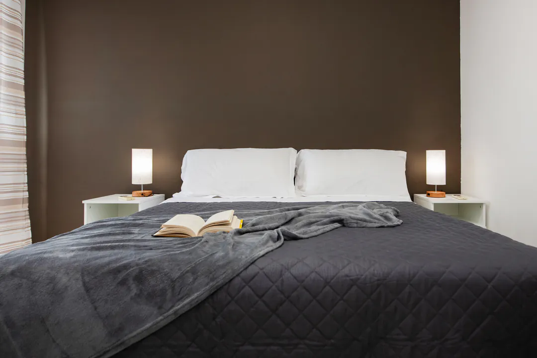 Double bed with bedside lamps