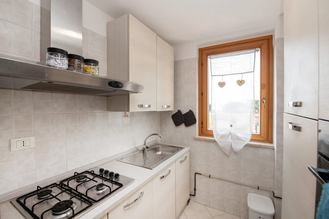 Kitchen with gas hob and window