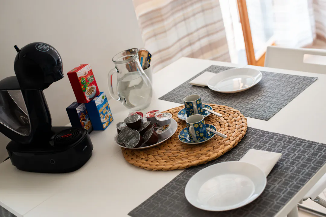 Coffee machine and breakfast on the table