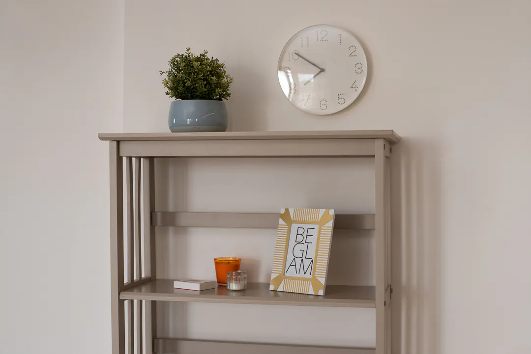 Shelf with clock and plants