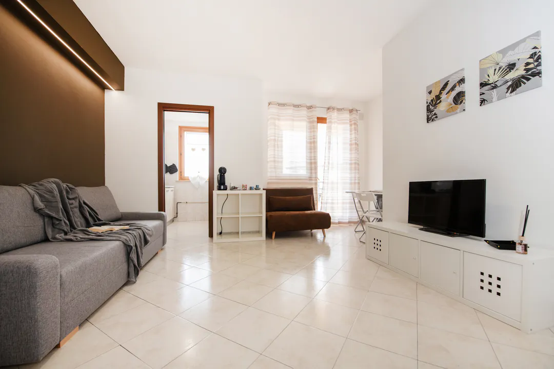 The bright living room of Appartamento Le Palme